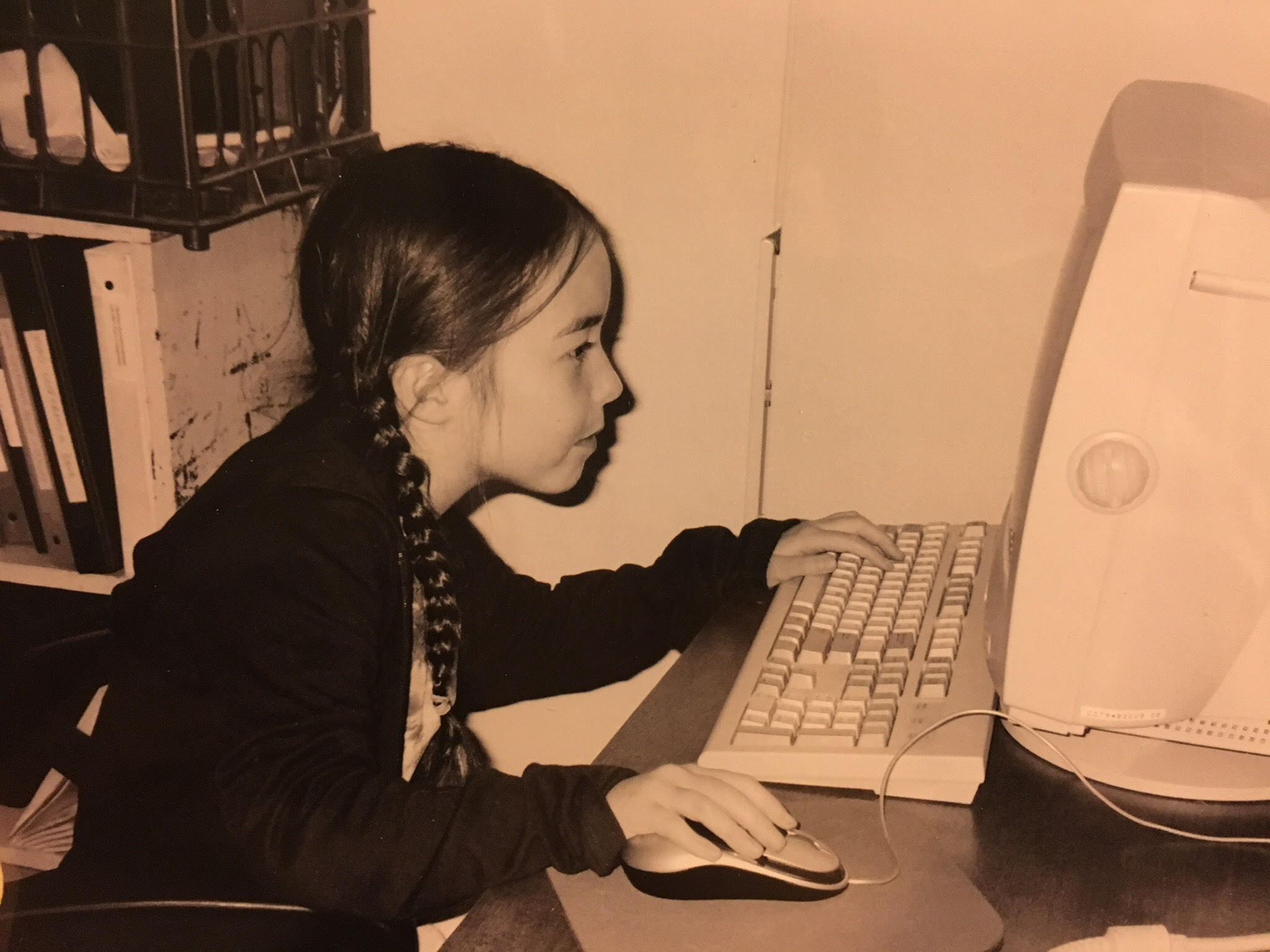  a young lady using the computer.